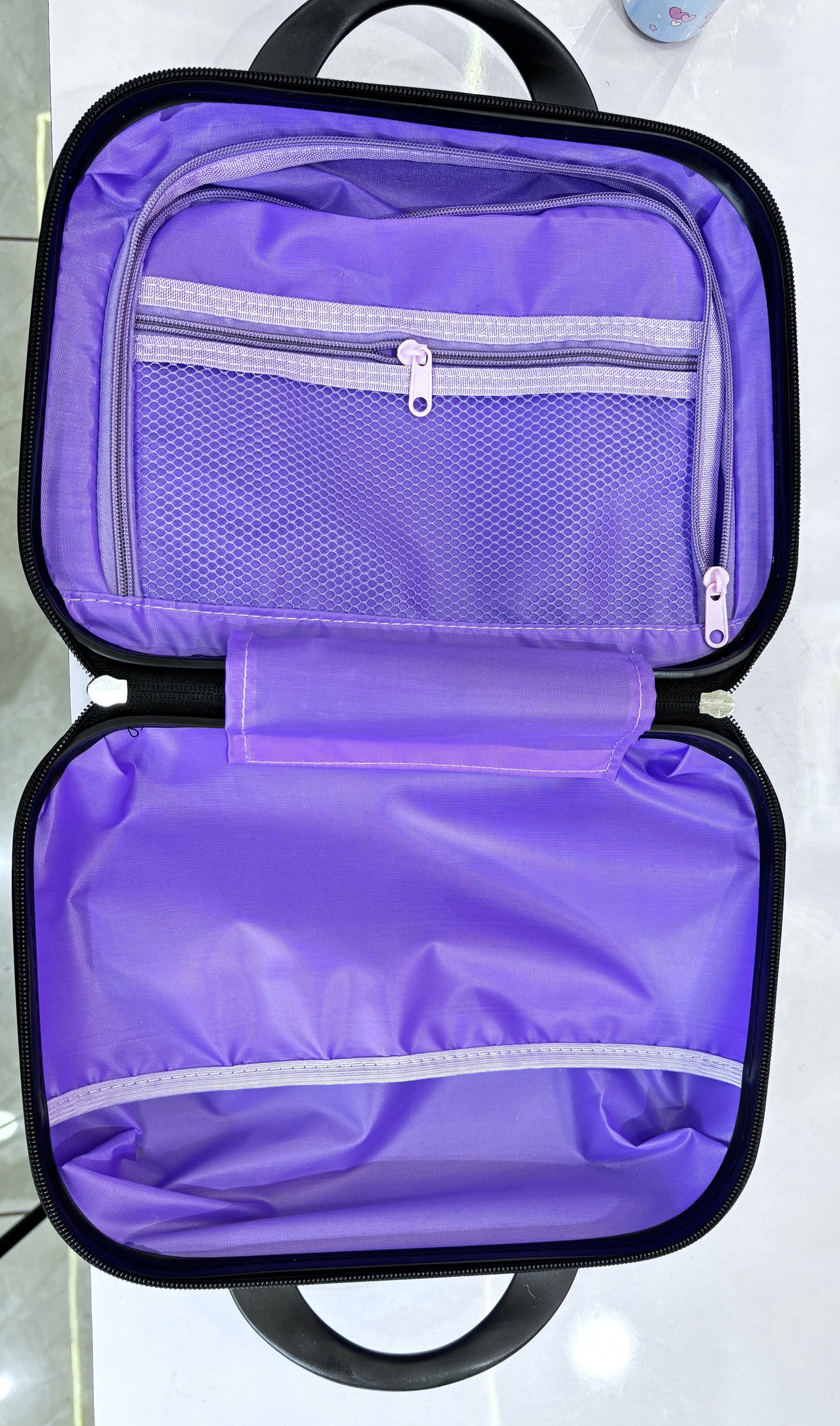 Assorted kids character luggage sets with matching vanity cases in multiple cartoon designs.