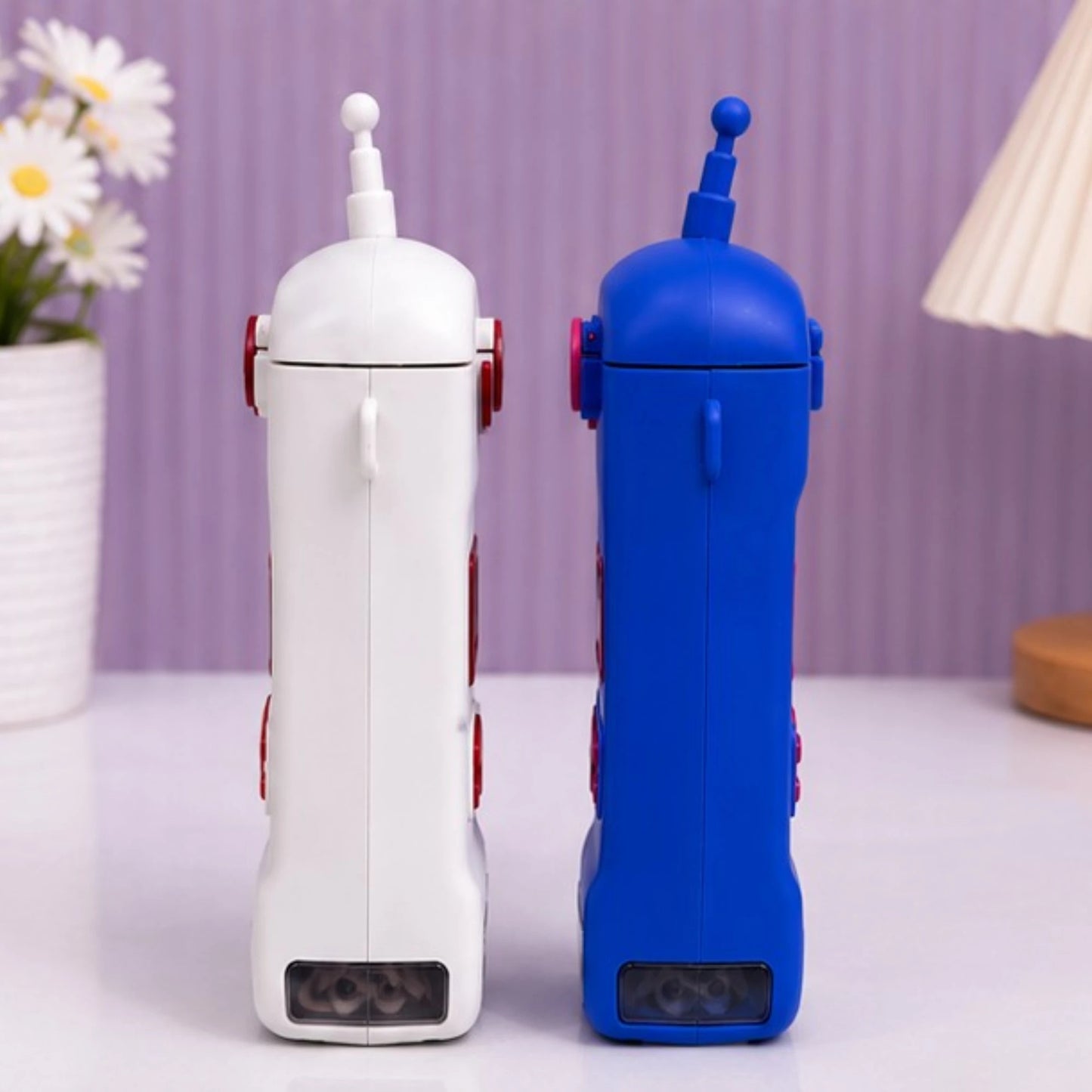 Walkie talkie shape kids sipper water bottle with straw and carry handles.